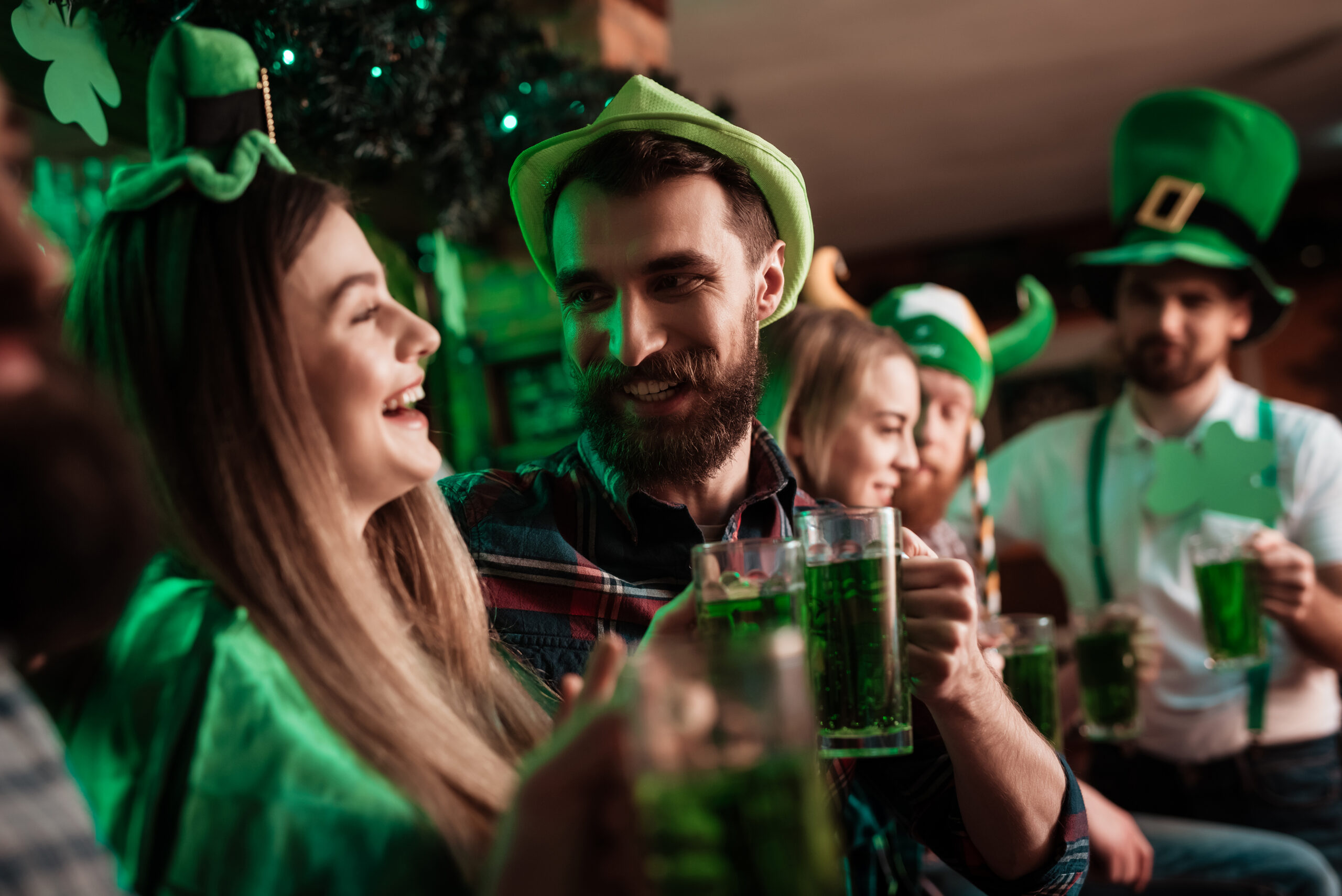 people drinking green beer